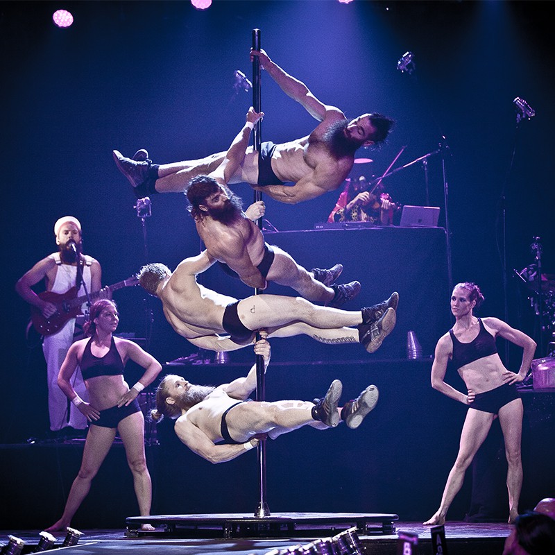 Circus performers on a pole