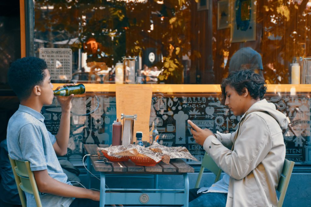 Teenage boys eating street food