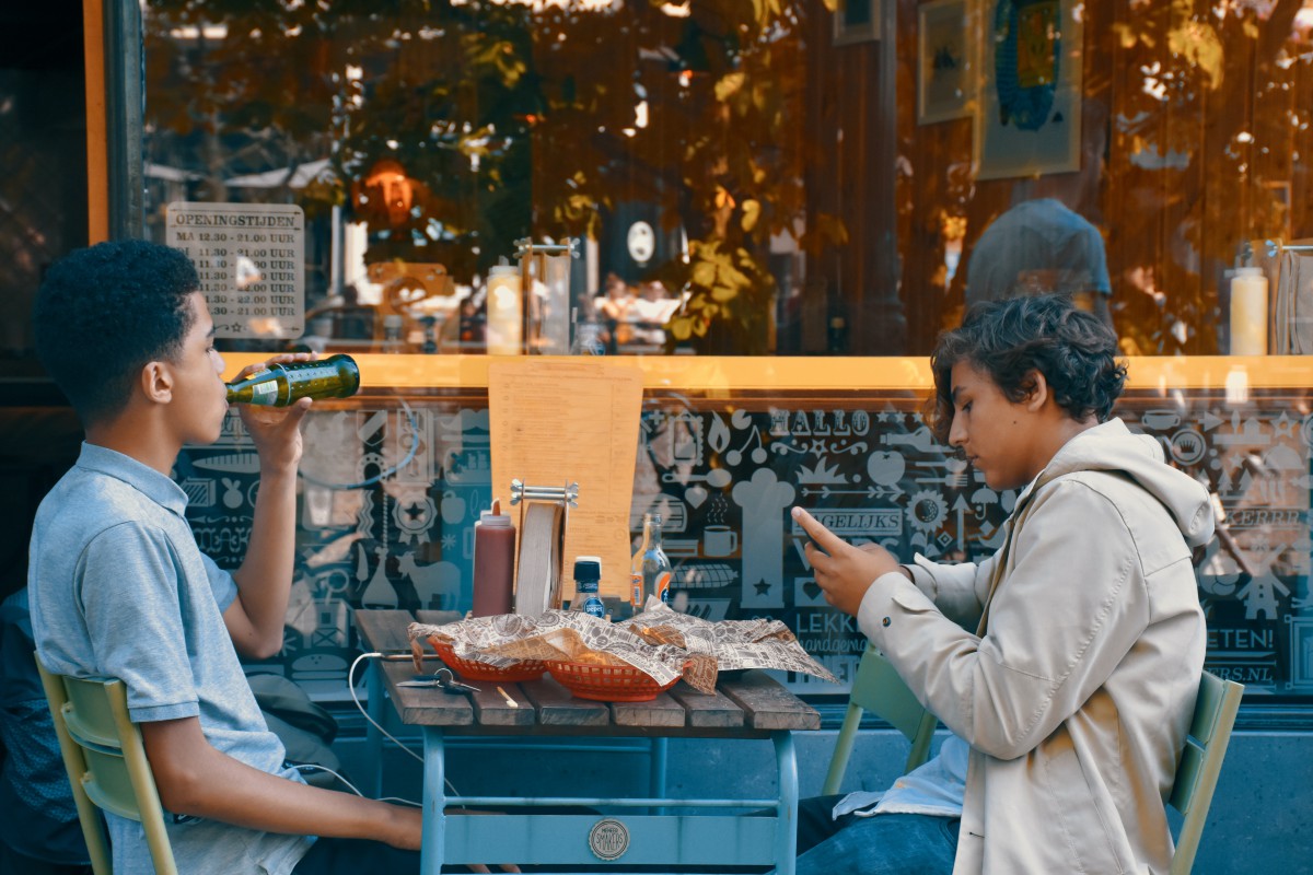 Teenage boys eating street food