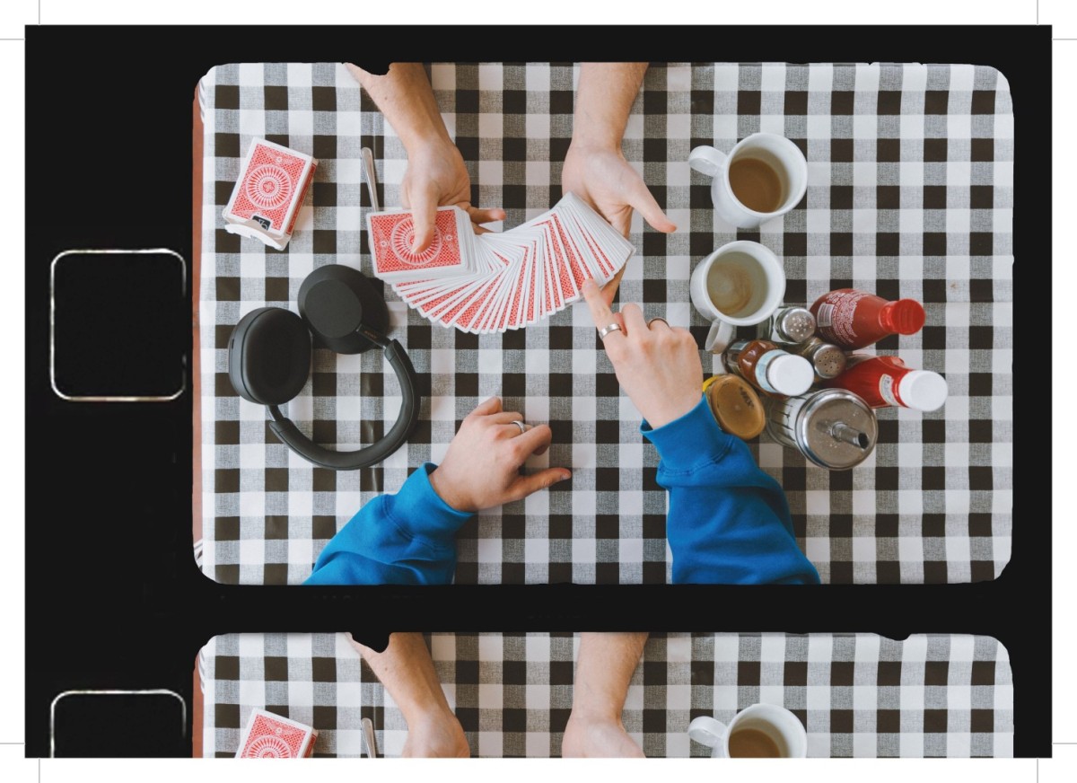 Cards and headphones on a cafe table