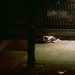 Person sleeping on the floor outside